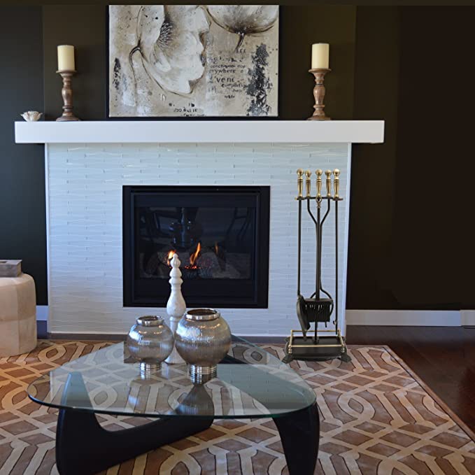 gas fireplace with fireplace tool set in living room and custom surround