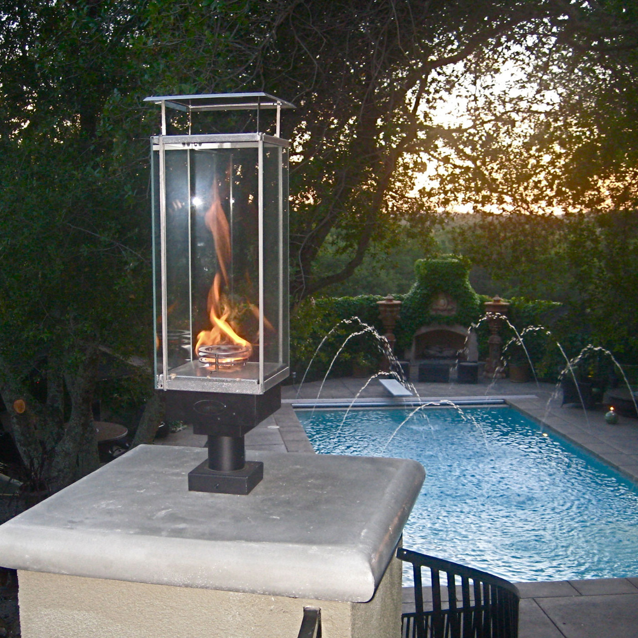 tempest torch lantern by poolside on back patio